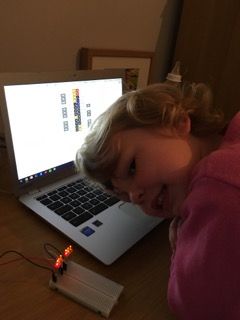 Sienna wiring up LED's on a breadboard